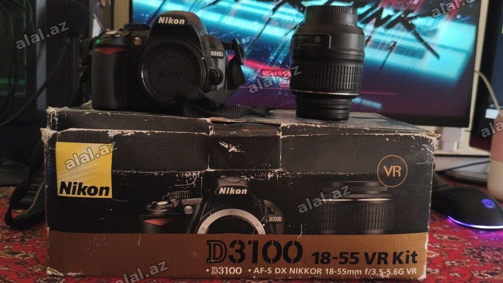 Nikon D3100 18-55 VR Kit - Fotoaparat: Nikon D3100 (DX format