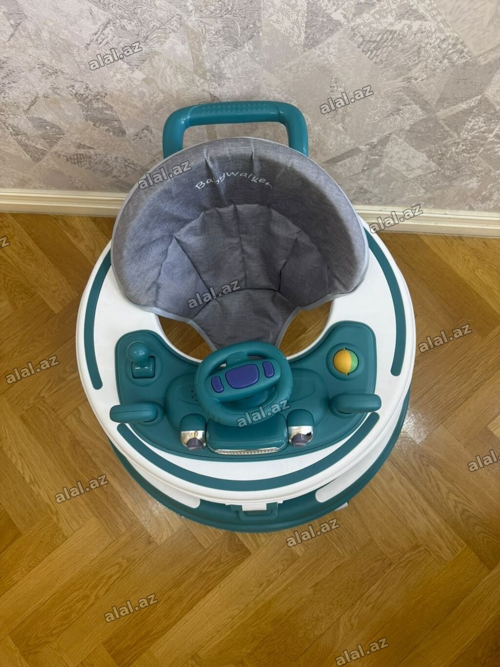 Uşaq gəzdirəci (Babywalker) – dairəvi konstruksiyalı, tünd yaşıl-ağ