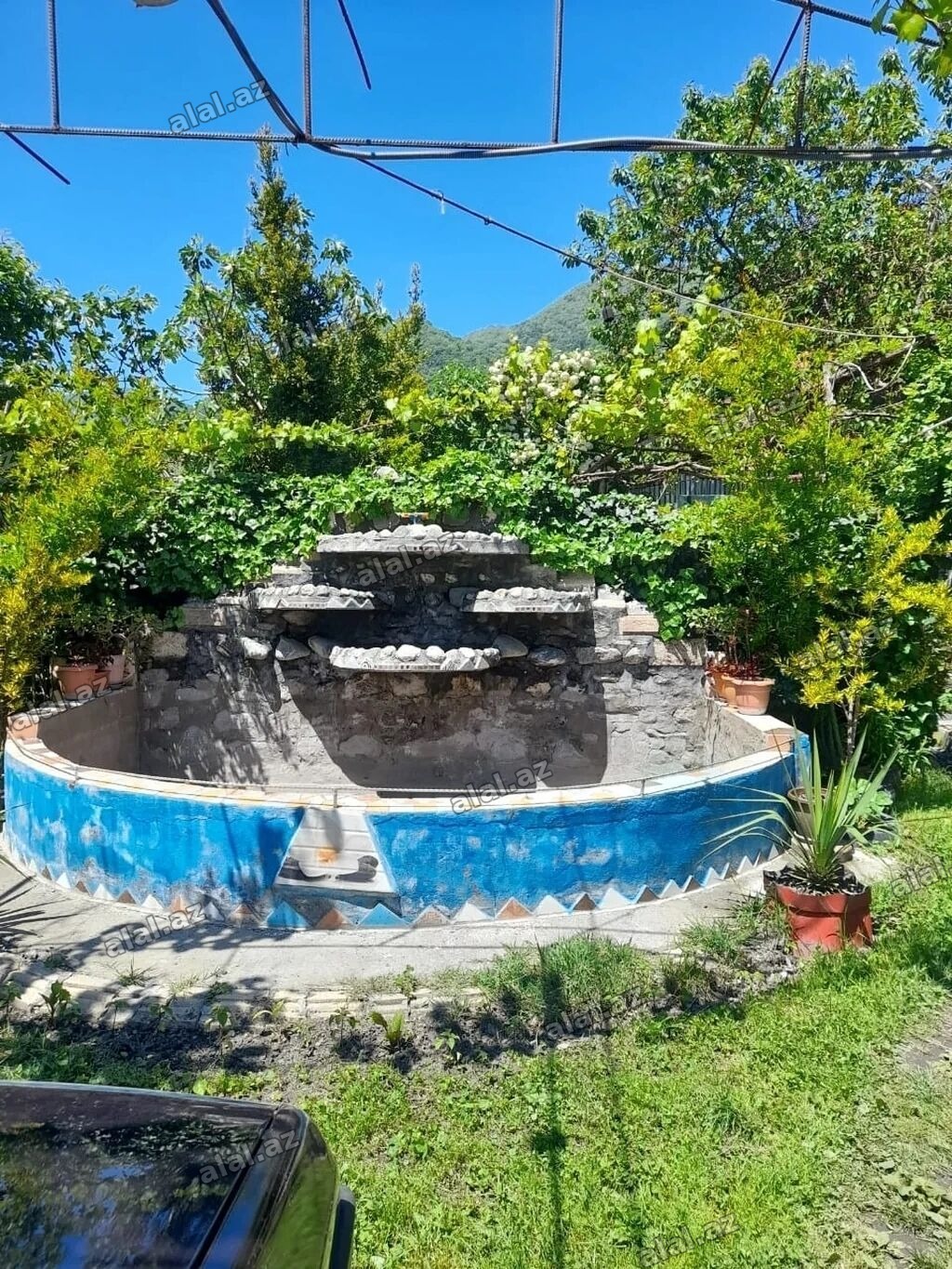 Kirayə üçün həyət evi - Yaşıl, sakit həyətli mülk: dekorativ daşdan